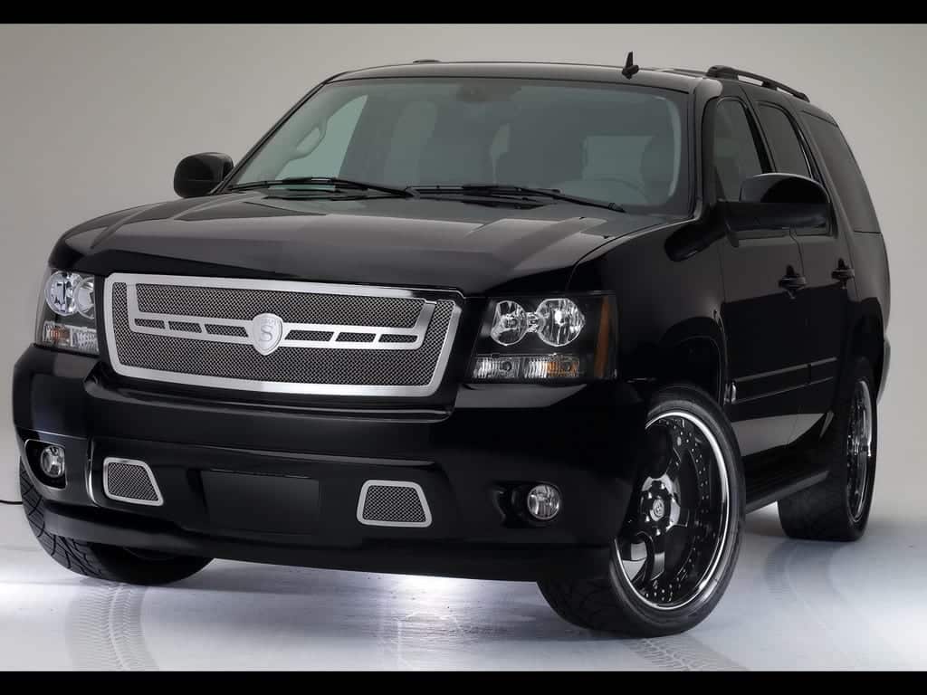 Like a phoenix rising from the ashes, its polished black exterior shimmers under the studio lights, with a grille as fierce and striking as flames and alloy wheels gleaming like embers. This SUV stands in all its glory, akin to a well-crafted web design that marries elegance with meticulous attention to detail, captivating all who behold it.